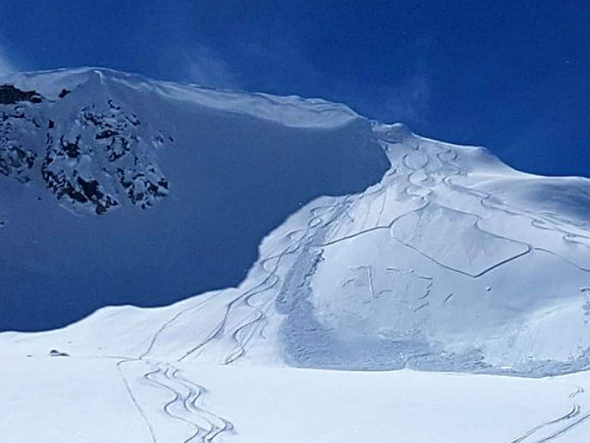 Two small skier-triggered avalanches are seen in this file photo taken near the Alberta-British Columbia border. (Robson Fletcher/CBC - image credit)