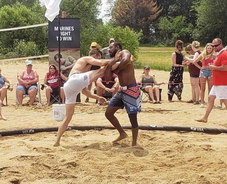 Cardinal Gibbons HS wrestling coach Jamal Morris (pictured right).