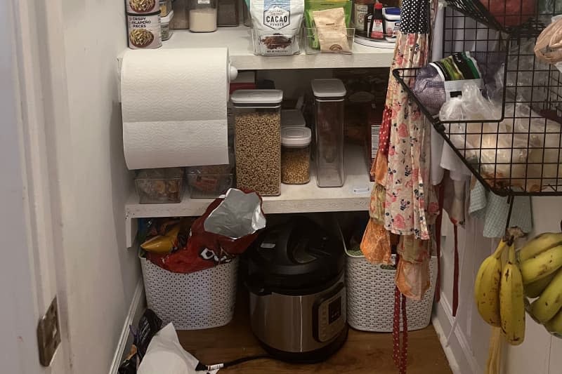 Messy pantry before organizing.