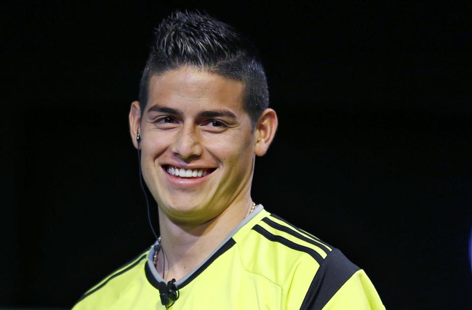 Colombian soccer player James Rodriguez of Real Madrid smiles during a promotional event by a Japanese automaker in Tokyo, Thursday, July 9, 2015. (AP Photo/Shizuo Kambayashi)