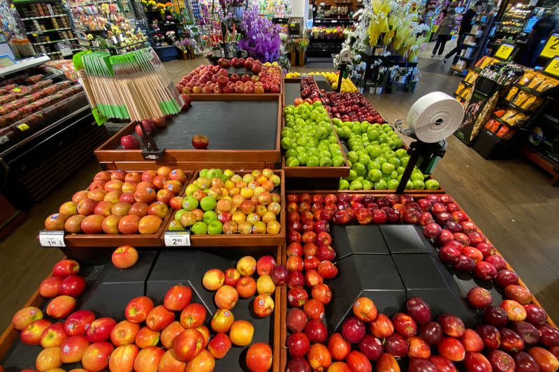 FILE PHOTO: Apples are displayed for sale at the produce area as customers browse grocery store shelves inside Kroger Co.'s Ralphs supermarket amid fears of the global growth of coronavirus cases, in Los Angeles