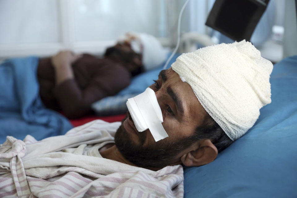 A wounded man receives treatment in a hospital after a bomb explosion during Friday prayer on the outskirts of Kabul, Afghanistan, Friday, May 24, 2019. According to Kabul police chief's spokesman, Basir Mujahid, the bomb was concealed in the microphone used to deliver the sermon. The prayer leader, Maulvi Samiullah Rayan, was the intended target, the spokesman added. (AP Photo/Rahmat Gul)