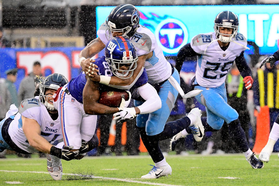 <p>Jawill Davis #80 of the New York Giants is tackled by Will Compton #51 and Kevin Byard #31 of the Tennessee Titans on a punt return during the first half at MetLife Stadium on December 16, 2018 in East Rutherford, New Jersey. (Photo by Steven Ryan/Getty Images) </p>