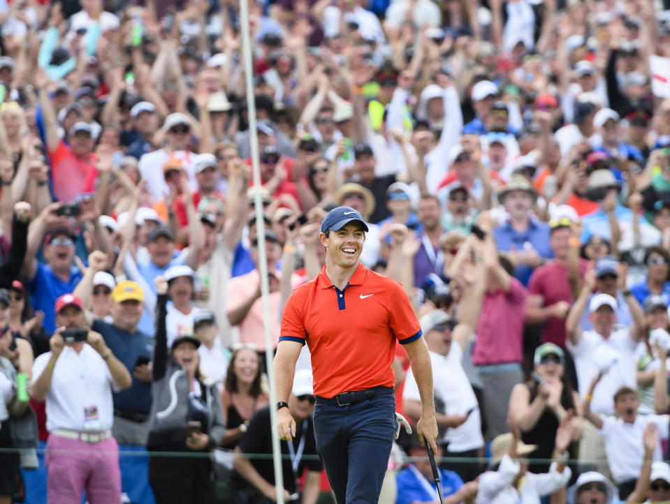 Rory McIlroy, of Northern Ireland, reacts to Webb Simpson's holed chip shot on the 18th hole during final round of the Canadian Open golf championship in Ancaster, Ontario, Sunday, June 9, 2019. McIlroy won the championship. (Nathan Denette/The Canadian Press via AP)