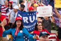 <p>Demonstrators wave national flags and placards during the pro-Trump ‘Mother of All Rallies’ on the National Mall in Washington on Sept. 16, 2017. Supporters of President Donald Trump gathered in the US capital to show support of “free-speech” dubbed the Mother of All Rallies. (Photo: Zach Gibson/AFP/Getty Images) </p>