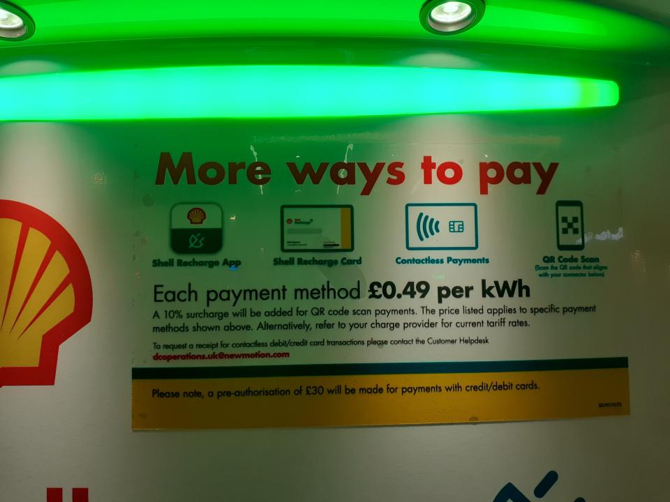 A sign on the charger at Shell Recharge, Fulham. It costs £0.49 per KWh to charge an electric car.