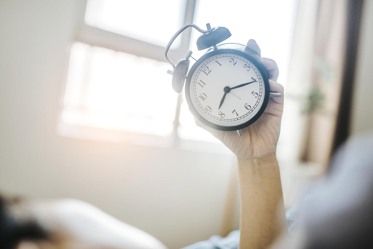 Want to stop waking up so early — or trying to shake your night owl habits? Experts offer tips for adjusting your sleep schedule. (Getty Images)