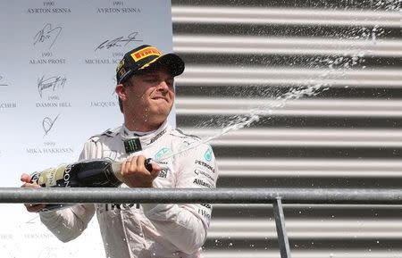 Belgium Formula One - F1 - Belgian Grand Prix 2016 - Francorchamps, Belgium - 28/8/16 - Mercedes' Nico Rosberg of Germany celebrates on the podium after the Belgian F1 Grand Prix. REUTERS/Yves Herman