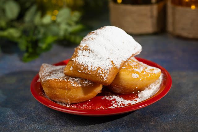 <p>Disney</p> Tiana’s Beignets with Honey Sauce will be served at Magic Kingdom’s Golden Oak Outpost.