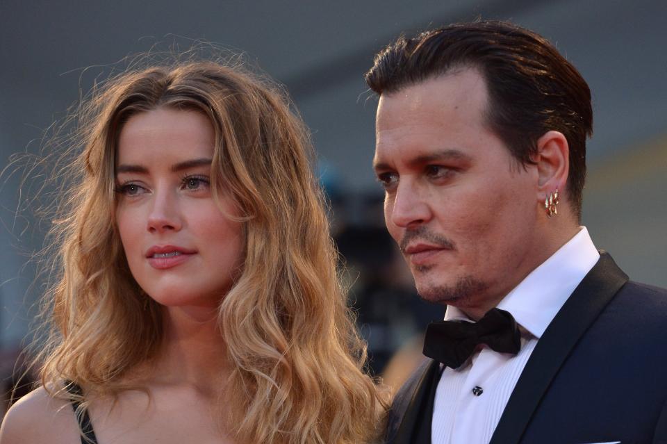 Johnny Depp y Amber Heard en el 2015 cuando estaban casados. (Photo credit should read TIZIANA FABI/AFP via Getty Images)