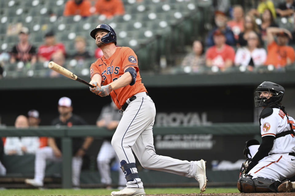 FILE - Houston Astros' Trey Mancini at bat in a baseball game, Sunday, Sept. 25, 2022, in Baltimore. When Chicago Cubs manager David Ross spoke with Trey Mancini about joining the team, the skipper mentioned playing first base, designated hitter and the corner outfield spots. “I told him ‘I don’t care where I play at all. I like playing. Wherever you want me, I'm there,'” Mancini said Monday, Jan. 23, 2023.(AP Photo/Gail Burton, File)