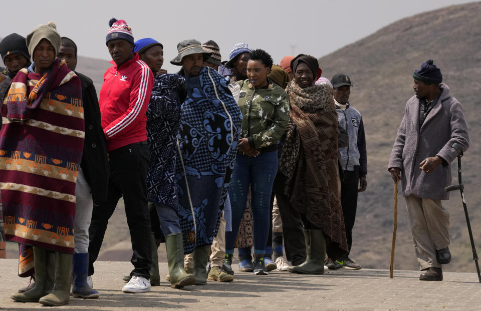 People line up to cast their votes at a polling station in Thaba-Tseka District, 82km east of Maseru, Lesotho, Friday, Oct. 7, 2022. Voters across Lesotho are heading to the polls Friday to elect a leader to find solutions to high unemployment and crime. (AP Photo/Themba Hadebe)