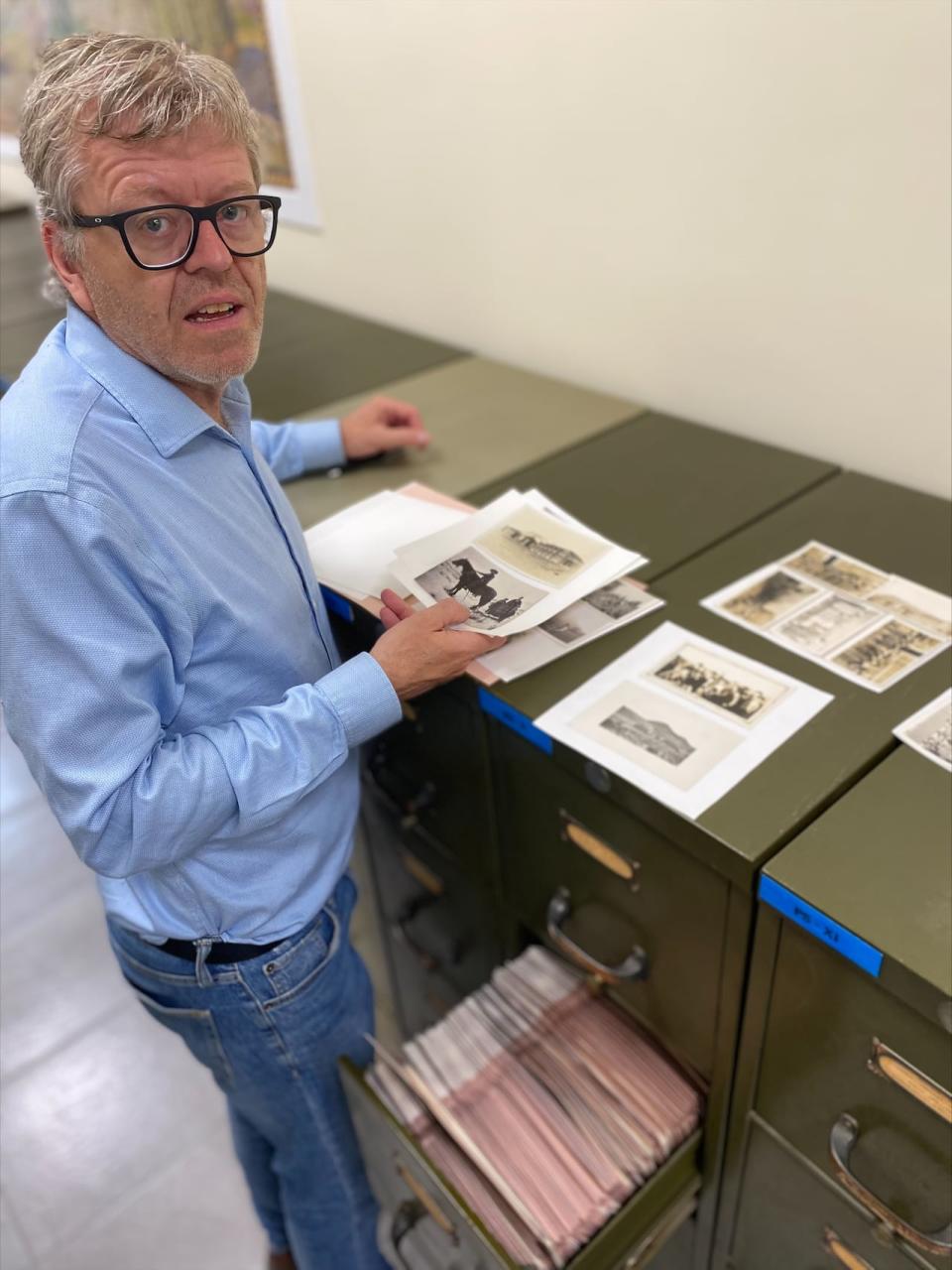 Raymond Frogner, head of archives at the National Centre for Truth and Reconciliation, goes through some of the early 20th century photos sent by priests from various residential schools to the Oblates.