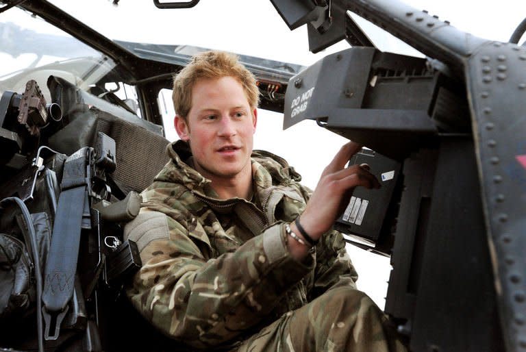 Prince Harry makes his early morning pre-flight checks at Camp Bastion in Afghanistan's Helmand Province