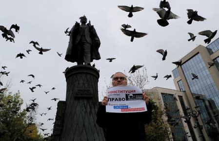 A man takes part in a protest demanding authorities to allow opposition candidates to run in the upcoming local election and release people arrested for participation in opposition rallies, in Moscow