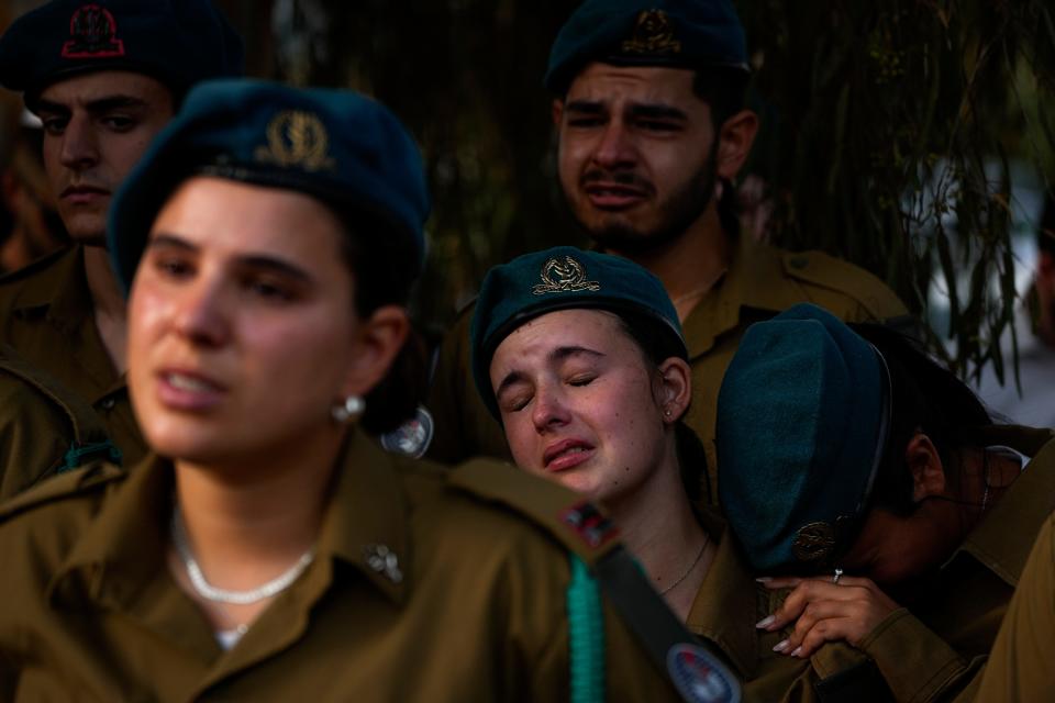 October 23, 2023: Israeli soldiers mourn during the funeral of Sgt. Yam Goldstein and her father, Nadav, in Kibbutz Shefayim, Israel. Yam and her father were killed by Hamas militants on Oct. 7 at their house in Kibbutz Kfar Azza near the border with the Gaza Strip. The rest of the family are believed to be held hostage in Gaza.