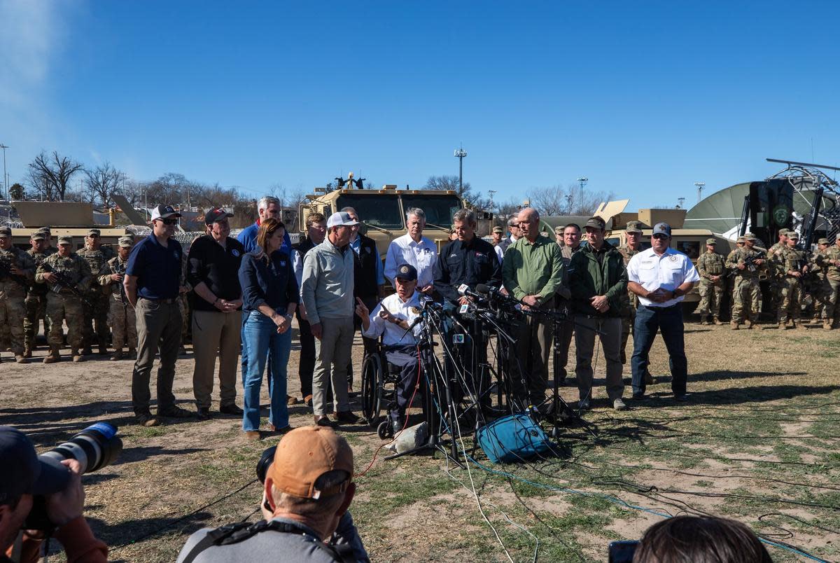 Flanked by Republican governors, Gov. Greg Abbott speaks to the press in Eagle Pass on Feb. 4, 2024.