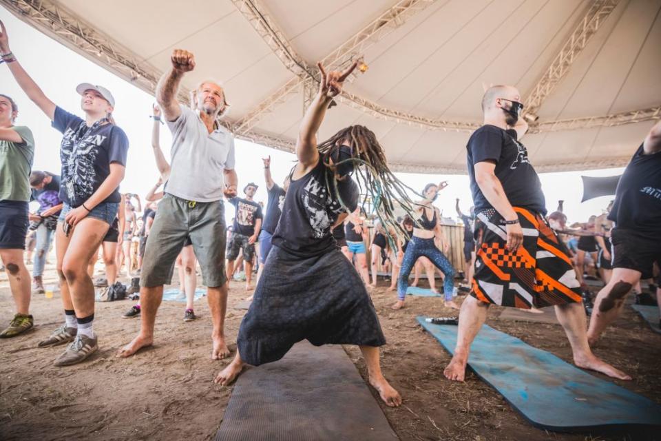 Visitors doing metal yoga during the Wacken Open Air festival in Germany (Picture: Getty)