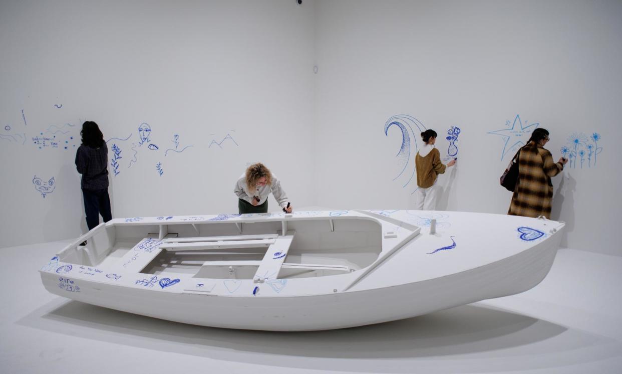 <span>Gallery assistants pose with a participatory installation entitled Add Colour (Refugee Boat) during the press preview of Yoko Ono: Music of the Mind exhibition at Tate Modern in London on 13 February 2024.</span><span>Photograph: Tolga Akmen/EPA</span>