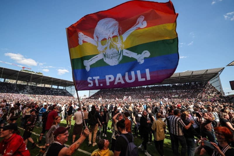 St. Pauli fans celebrate after the German Bundesliga 2 soccer match between FC St. Pauli and VfL Osnabruck at the Millerntor Stadium. Christian Charisius/dpa