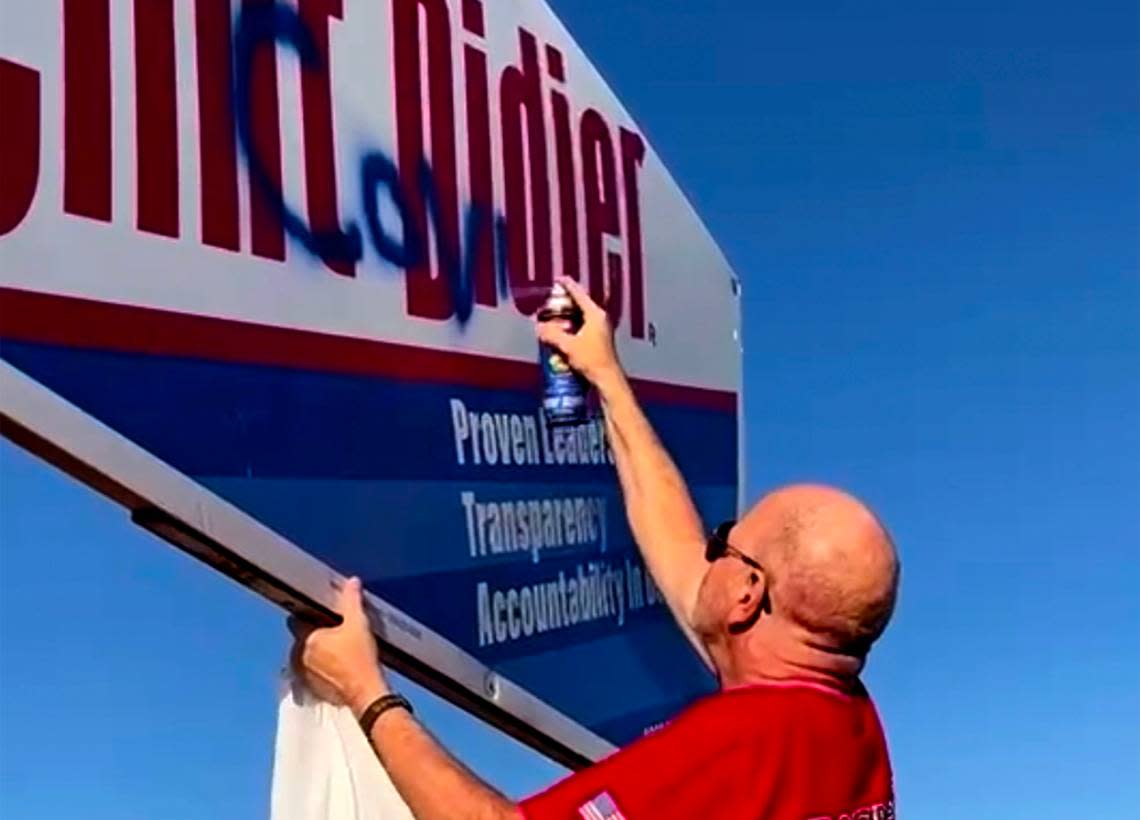 Steve Bauman with the Franklin County Republican Party recorded Michael Harrington, 68, of Pasco, spray painting “COVID Clint” on Commissioner Clint Didier’s campaign sign on Road 68 in Pasco.