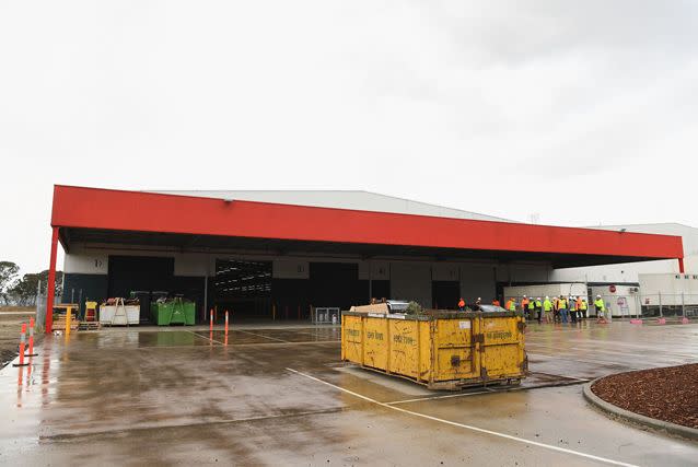 Large skip bins are still sitting on the site of the warehouse. Source: Getty Images