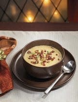 You can recreate Canadian Cheddar Cheese Soup a la Epcot with the recipe included in "The Unofficial Disney Parks EPCOT Cookbook" by Ashley Craft.