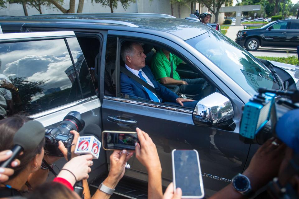 Members of the media photograph and videotape Trump attorney Evan Corcoran as he leaves the Paul G. Rogers Federal Building in downtown West Palm Beach on  September 1, 2022.