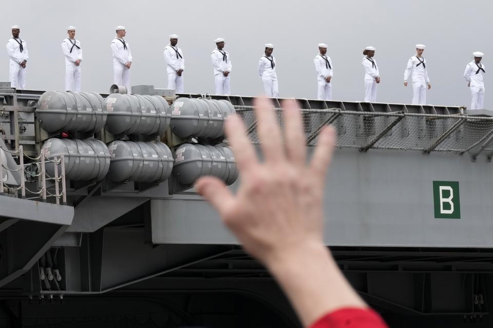 Sailors of the U.S. navy aircraft carriers USS Ronald Reagan (CVN-76) man the rails at the U.S. navy's Yokosuka base Thursday, May 16, 2024, in Yokosuka, south of Tokyo. This is the ship's final departure from Yokosuka before transiting back to the United States. (AP Photo/Eugene Hoshiko)