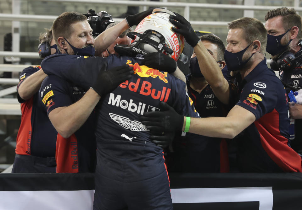 Red Bull driver Max Verstappen of the Netherlands celebrates after he won the pole position at the Formula One Abu Dhabi Grand Prix in Abu Dhabi, United Arab Emirates, Saturday, Dec. 11, 2020. (AP Photo/Kamran Jebreili, Pool)