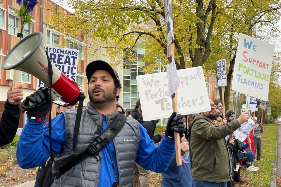 Teachers and their supporters hold signs, chant and rally the crowd with bullhorns on the first day of a teacher's strike in Portland, Oregon, Wednesday, Nov. 1, 2023.