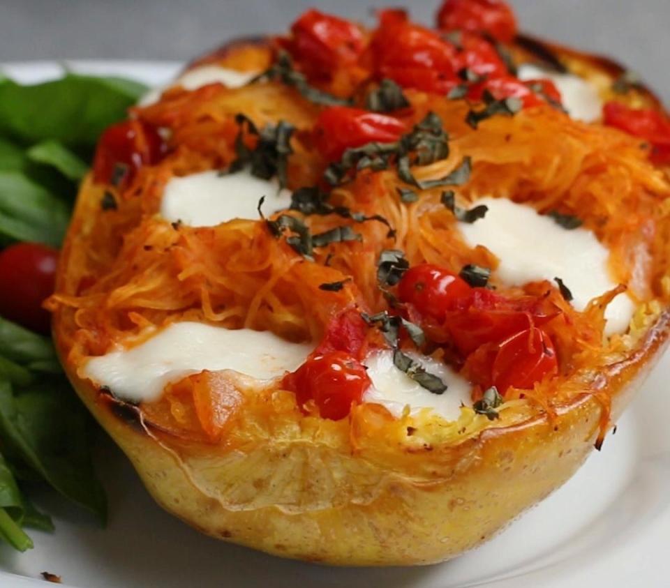 A Caprese-stuffed spaghetti squash half