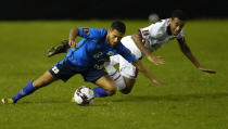 El Salvador's Joshua Perez, left, and United States' Tyler Adams fight for the ball during a qualifying soccer match for the FIFA World Cup Qatar 2022 at Cuscatlan stadium in San Salvador, El Salvador, Thursday, Sept. 2, 2021. (AP Photo/Moises Castillo)