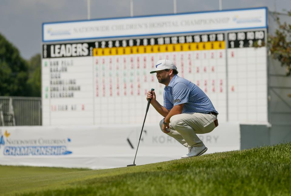 Greyson Sigg sits in front of the leaderboard during the Korn Ferry Tour Nationwide Children's Championship at Ohio State in 2021.
