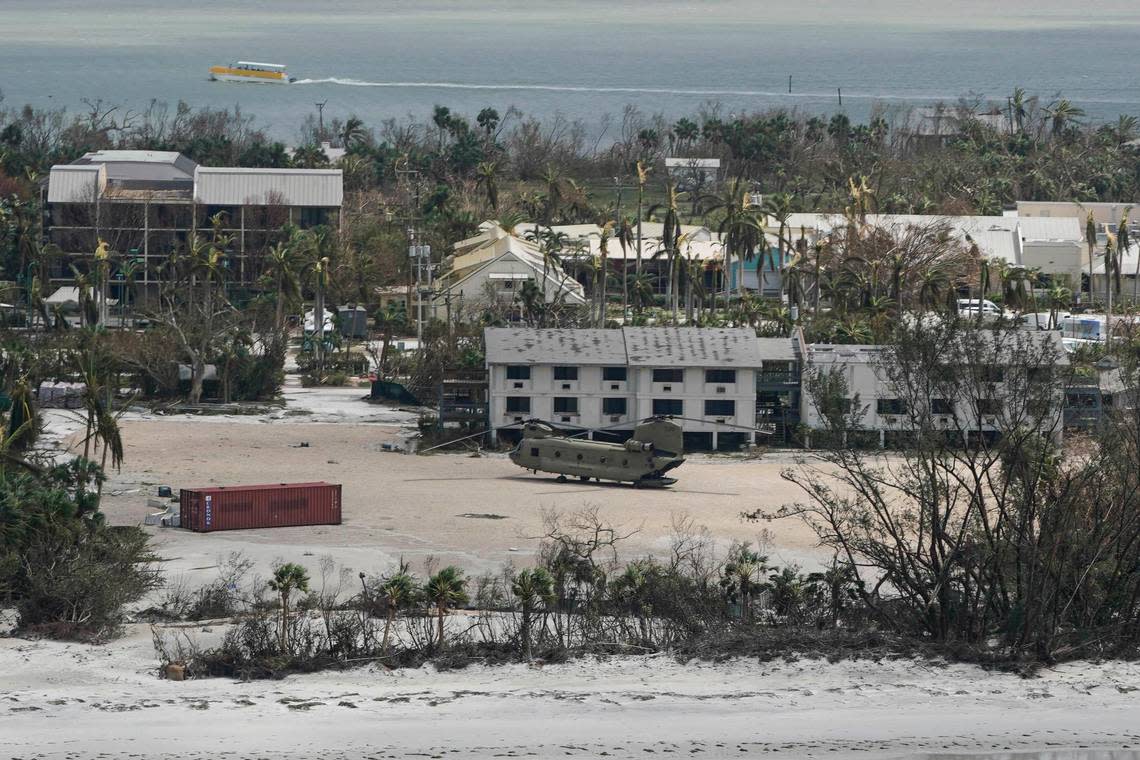 A military helicopter sits down on Sanibel Island in the wake of Hurricane Ian, Thursday, Sept. 29, 2022, in Fla. (AP Photo/Wilfredo Lee)