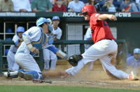 Stony Brook's Kevin Courtney, right, is tagged out at home plate by UCLA catcher Tyler Heineman on a double play hit into by Stony Brook batter Travis Jankowski in the fifth inning of an NCAA College World Series baseball game in Omaha, Neb., Friday, June 15, 2012. (AP Photo/Ted Kirk)