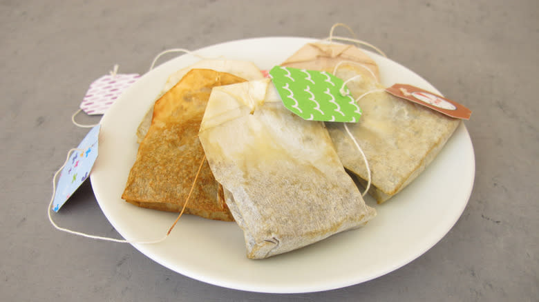 Dried tea bags on plate