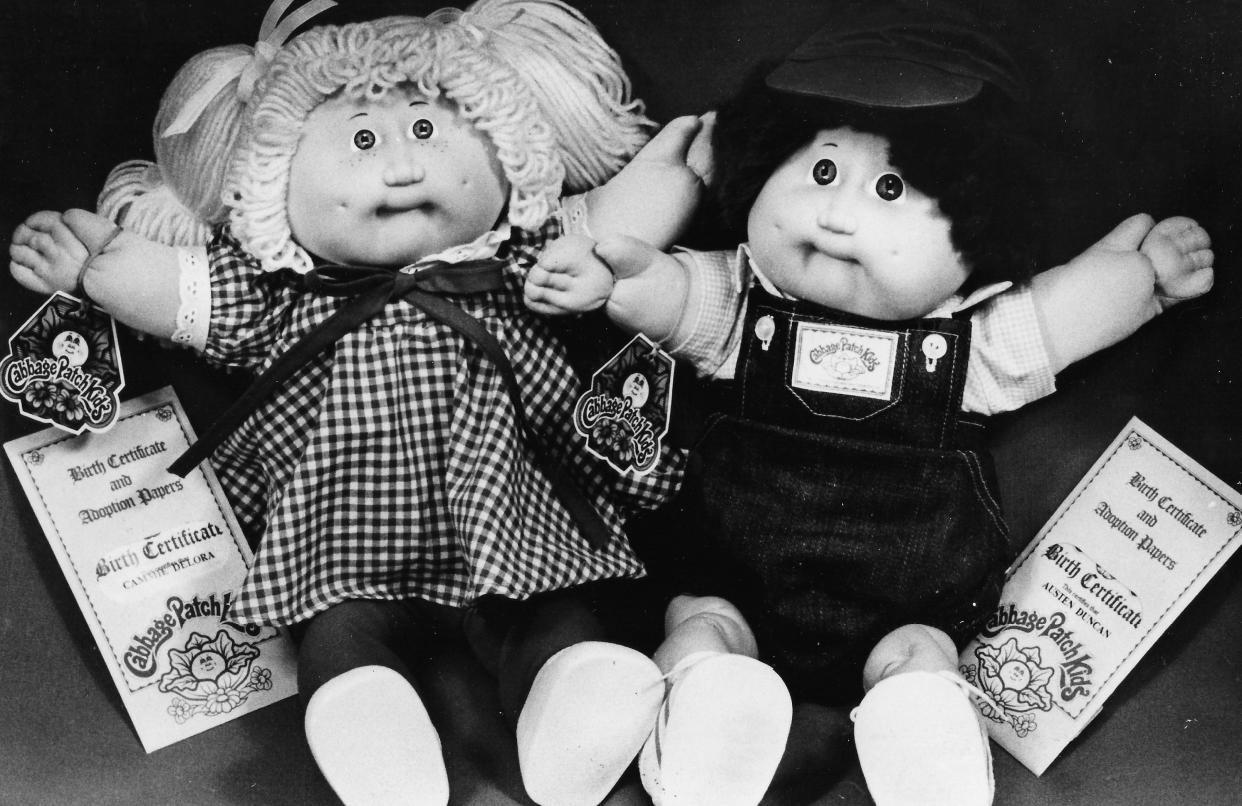 Cabbage Patch Kids, complete with birth certificates and adoption papers, wait for a happy home in 1984.