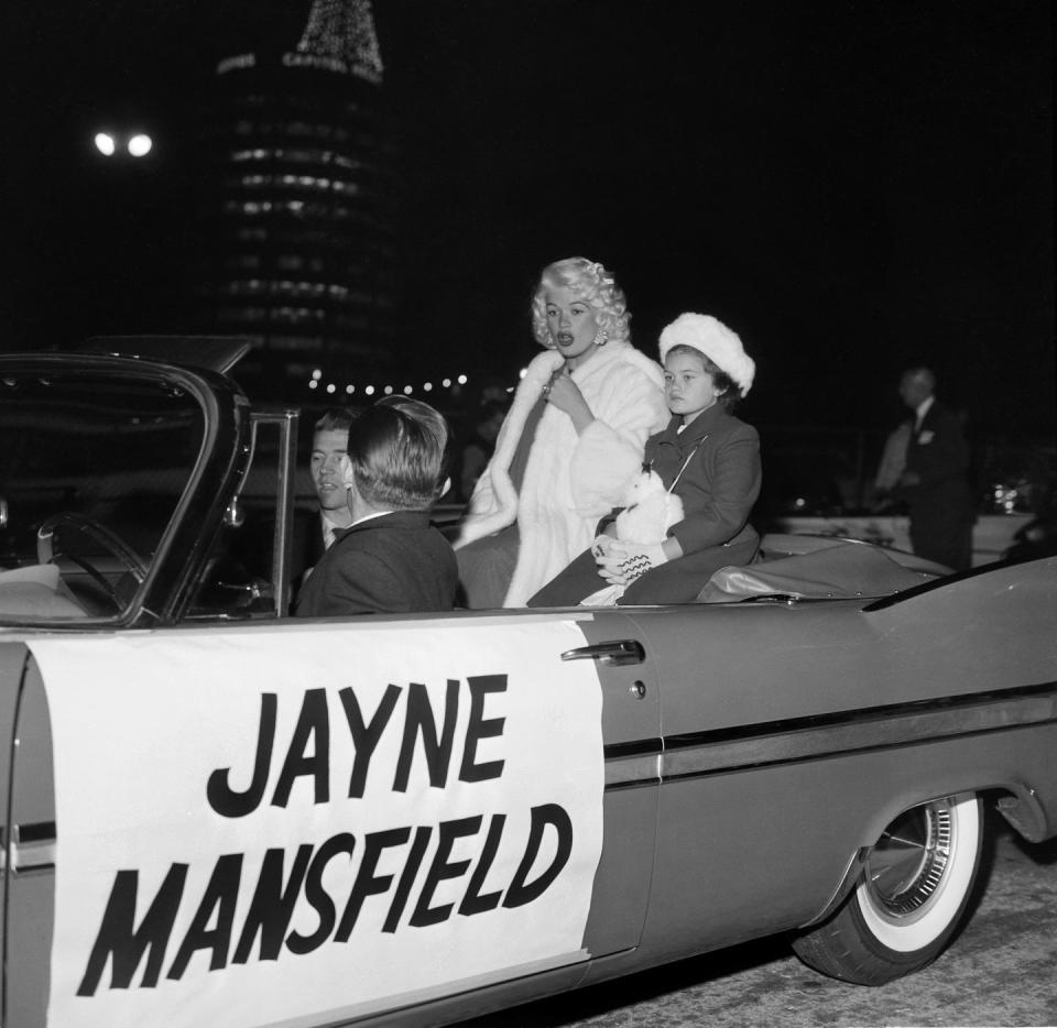 <p>You couldn't miss Jayne Mansfield as she and her daughter rode through the Christmas parade in Hollywood in 1958. </p>