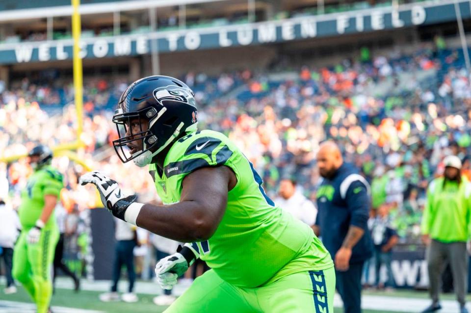 Seattle Seahawks offensive tackle Charles Cross (67) warms up prior to the start of an NFL game against the Denver Broncos on Monday, Sept. 12, 2022, at Lumen Field in Seattle.