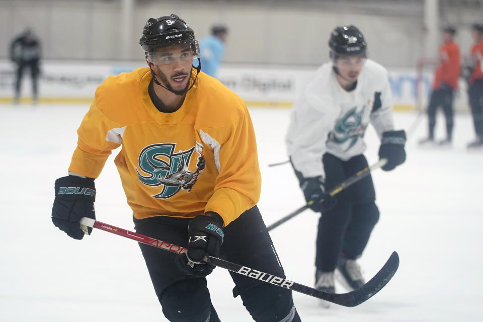 San Jose Barracuda's Evander Kane, left, skates during a hockey practice in San Jose, Calif., Tuesday, Nov. 30, 2021. Kane reported to the San Jose Sharks' minor league affiliate for the first time since serving a suspension for submitting a fake COVID-19 vaccination card. (AP Photo/Jeff Chiu)