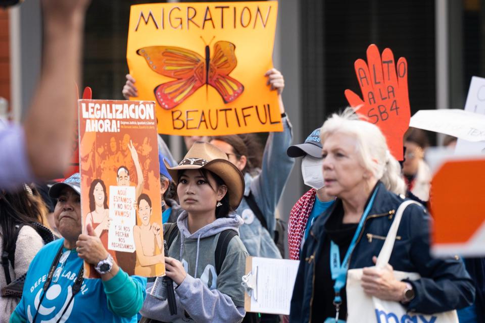 Protesters march Saturday in downtown Austin to call for a repeal of Senate Bill 4, which would allow state and local law enforcement to arrest and deport people who they think entered the country illegally.