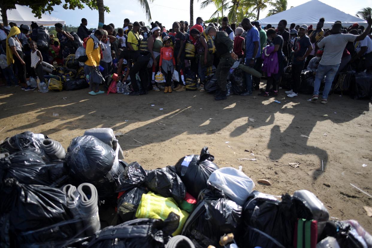 Haitian migrants wait in line to board a boat to navigate to the border with Panama in Necocli, Colombia, on September 23, 2021. (Raul Arboleda/AFP via Getty Images)