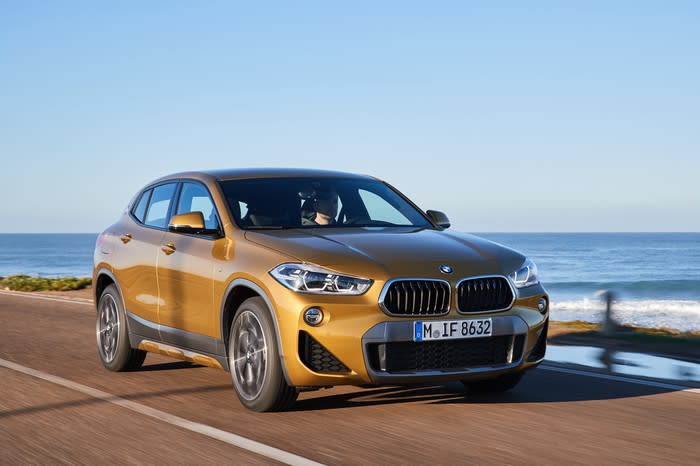 A 2020 BMW X2, a compact crossover SUV, on a coastal road.