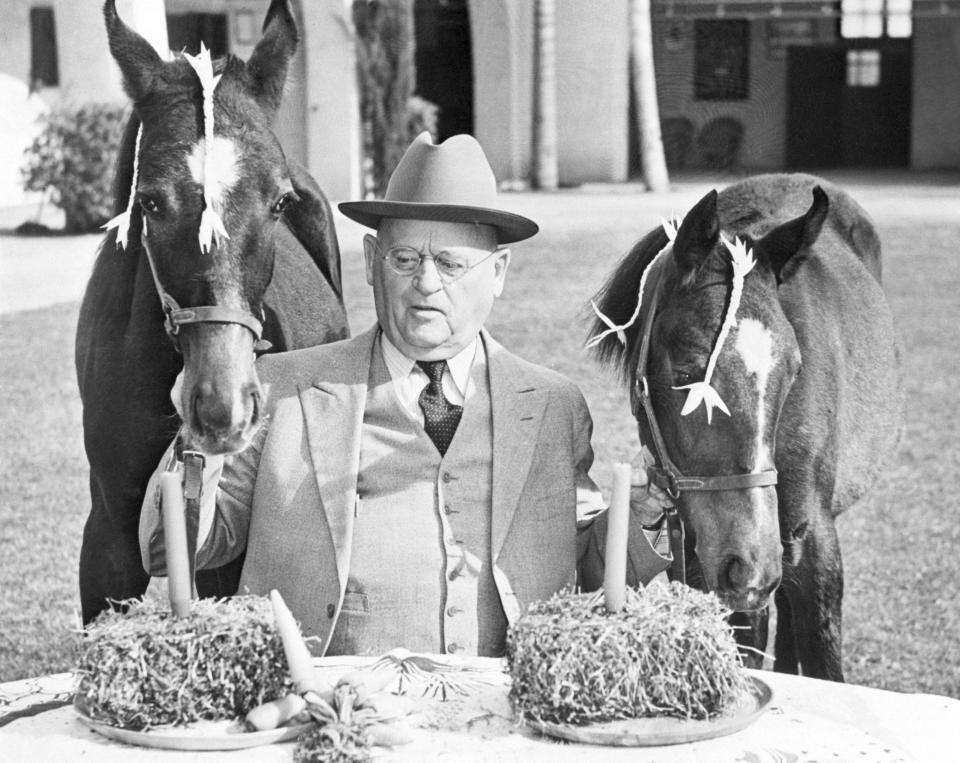 Kellogg founder W.K. Kellogg holds the bridles of twin Arabian colts.