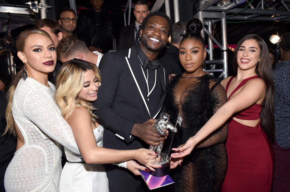(L-R) Dinah Jane and Ally Brooke of Fifth Harmony, Gucci Mane, and Normani Kordei and Lauren Jauregui of Fifth Harmony pose backstage during the 2017 MTV Video Music Awards at The Forum on Aug. 27, 2017 in Inglewood, California.&nbsp;