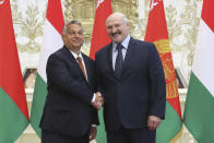 Belarusian President Alexander Lukashenko, right, and Hungarian Prime Minister Viktor Orban pose for photo during their meeting in Minsk, Belarus, Friday, June 5, 2020. (Maxim Guchek/BelTA Pool Photo via AP)