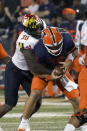 Maryland linebacker Durell Nchami sacks Illinois quarterback Brandon Peters during the first half of an NCAA college football game Friday, Sept. 17, 2021, in Champaign, Ill. (AP Photo/Charles Rex Arbogast)