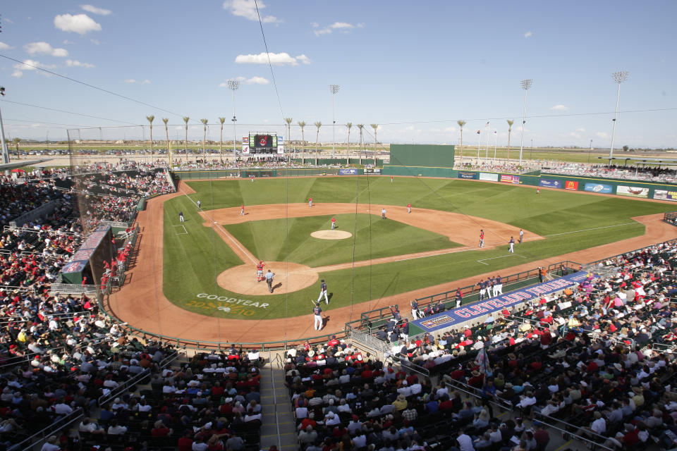 FILE - In this Saturday, March 6, 2010 file photo, The Cincinnati Reds play the Cleveland Indians in a spring training baseball game at Goodyear Ball Park in Goodyear, Ariz. Putting all 30 teams in the Phoenix area this season and playing in empty ballparks was among the ideas discussed Monday, April 6, 2020 during a call among five top officials from MLB and the players' association that was led by Commissioner Rob Manfred, people familiar with the discussion told The Associated Press. (AP Photo/Mark Duncan, File)