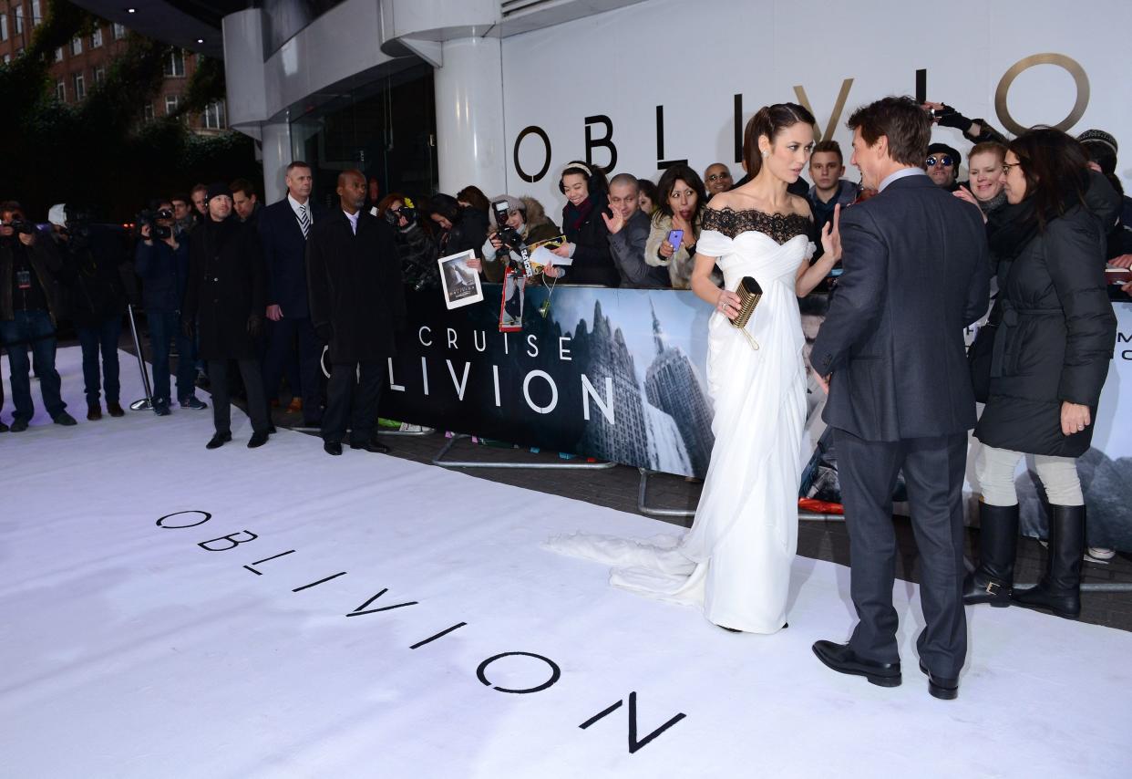 Olga Kurylenko and Tom Cruise attends the UK premiere of "Oblivion" at BFI IMAX on April 4, 2013 in London, England.